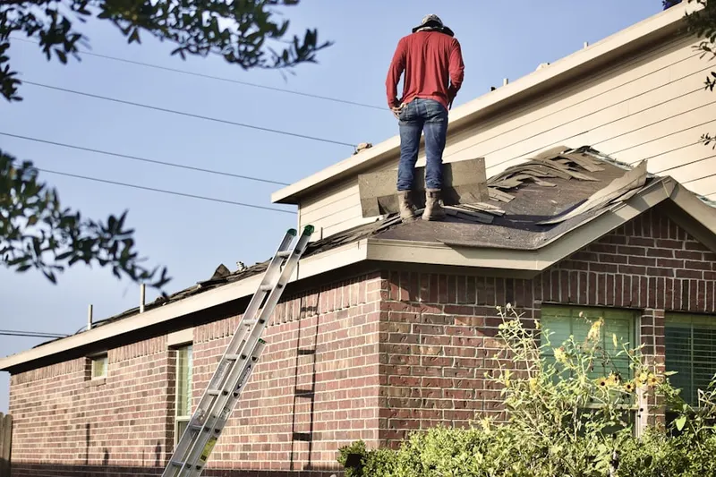 Professional roofer working on a residential roof in Novato